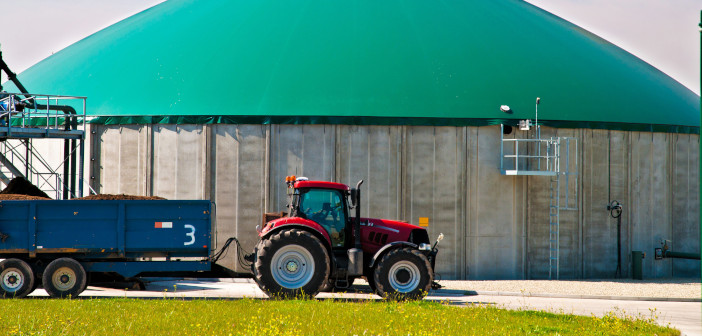 BPS advance payments issued to farmers Red,Tractor,In,Front,Of,A,Biogas,Plant