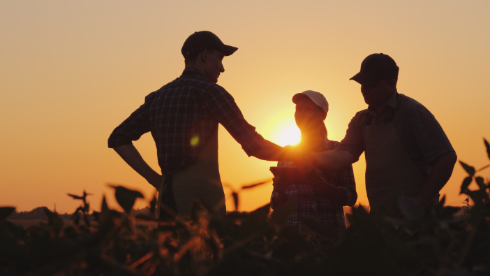 A,Group,Of,Farmers,In,The,Field,,Shaking,Hands.,Family