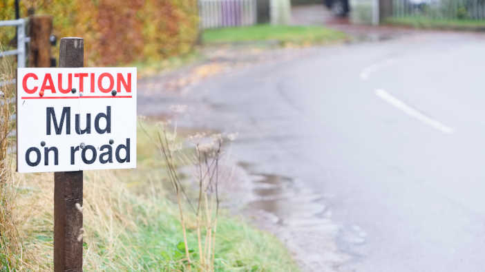 Plan ahead to avoid leaving mud on the road this autumn Caution,Mud,On,Road,Sign,At,Bend