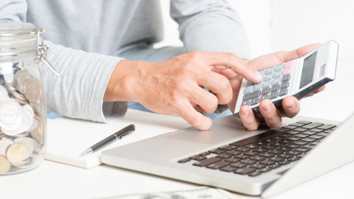 Keeping cash flowing Man,Doing,His,Accounting,,With,Laptop,Computer,,Calculator,,Diary,And