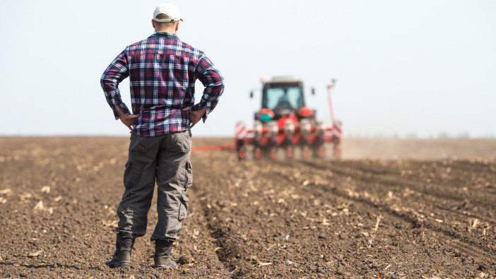 Agrovista forges partnership with leading agricultural charities young farmer on farmland