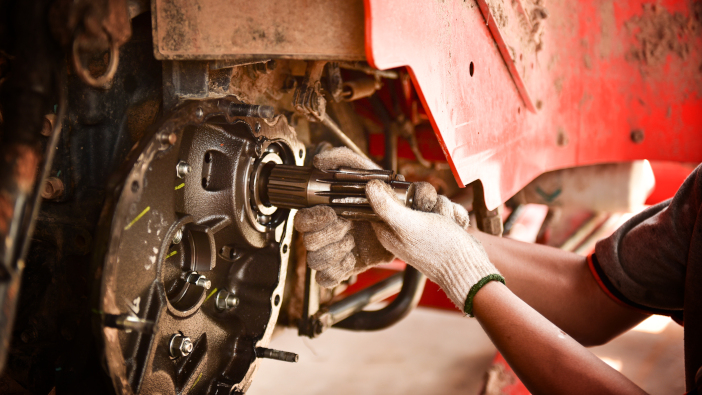 AGCO gives financial boost to agricultural apprenticeships A,Mechanic,Is,Repairing,A,Tractor,Used,In,Agriculture.