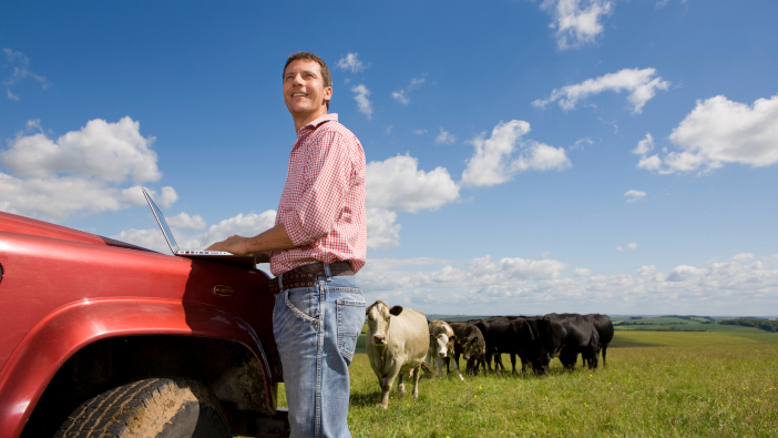 Lack of rural connectivity is holding farming back according to the NFU A,Low,Angle,Medium,Shot,Of,A,Farmer,Looking,Up