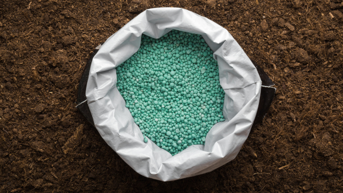 ADM fertiliser market report – 14th July Opened,Plastic,Bag,With,Green,Complex,Fertiliser,Granules,On,Dark