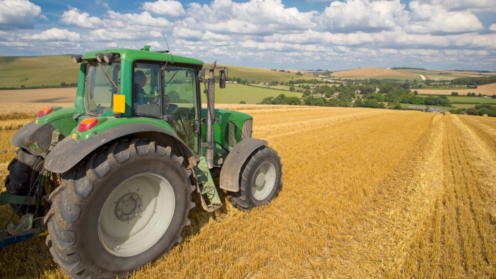 Green,Tractor,In,Sunny,Rural,Field
