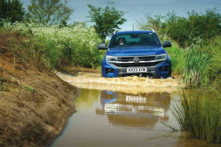 Lowdown on the latest pickups and four-wheel-drive vehicles 4-4 driving through water