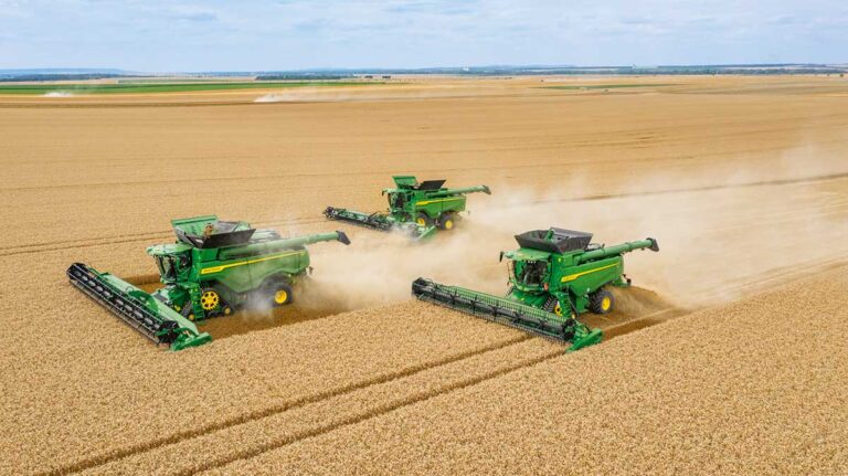 Getting the most out of combine harvestesters Aerial view of John Deere combines in field