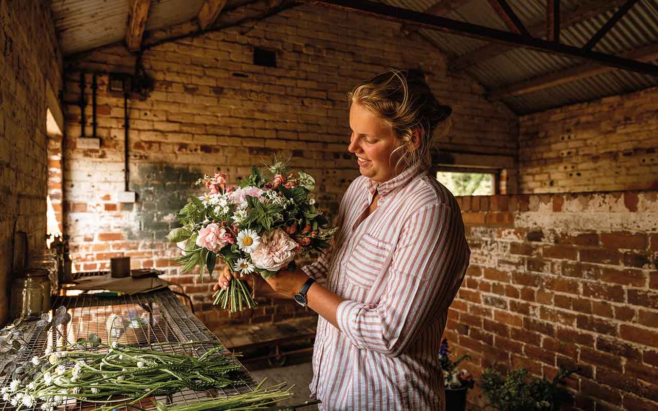 Ellen Firth with flower arrangement
